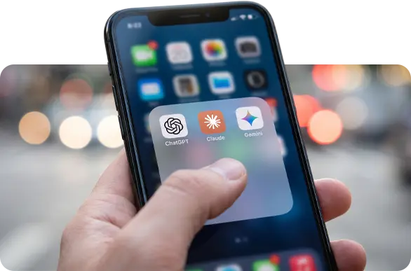 Ai Chat apps on iPhone screen held in a hand on streetscape.